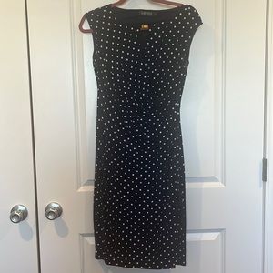 Size 4 women’s dress, navy blue and white with classic polka dot pattern.